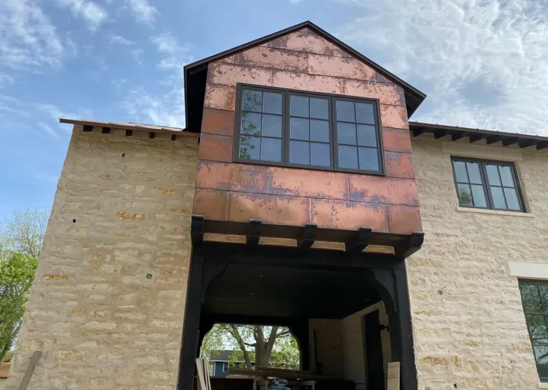 Copper metal panel facade on a stone building for Metal Roof Coating in Minden
